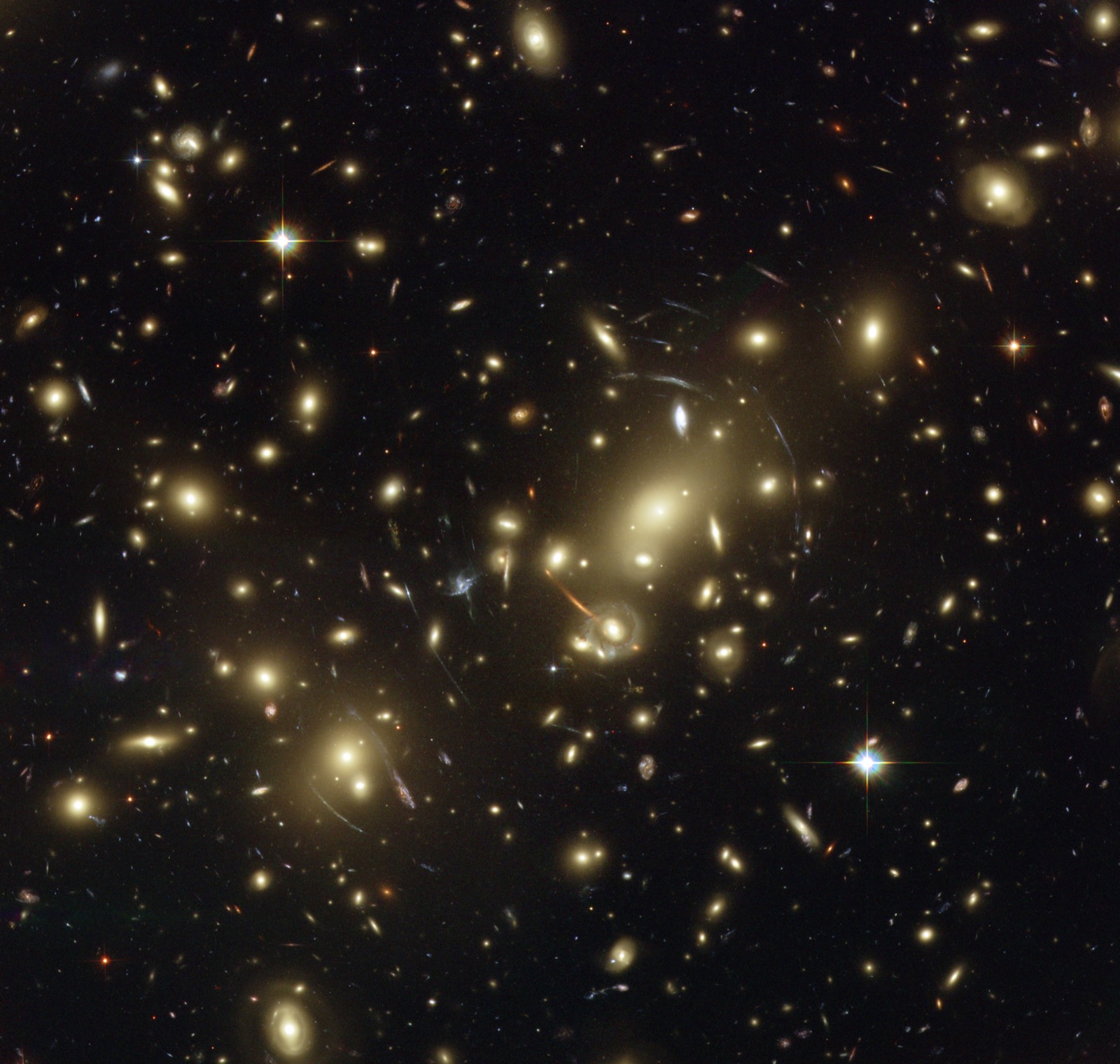 Hubble image of the galaxy cluster Abell 2218, whose arcs of lensed light trace the curvature of four-dimensional spacetime