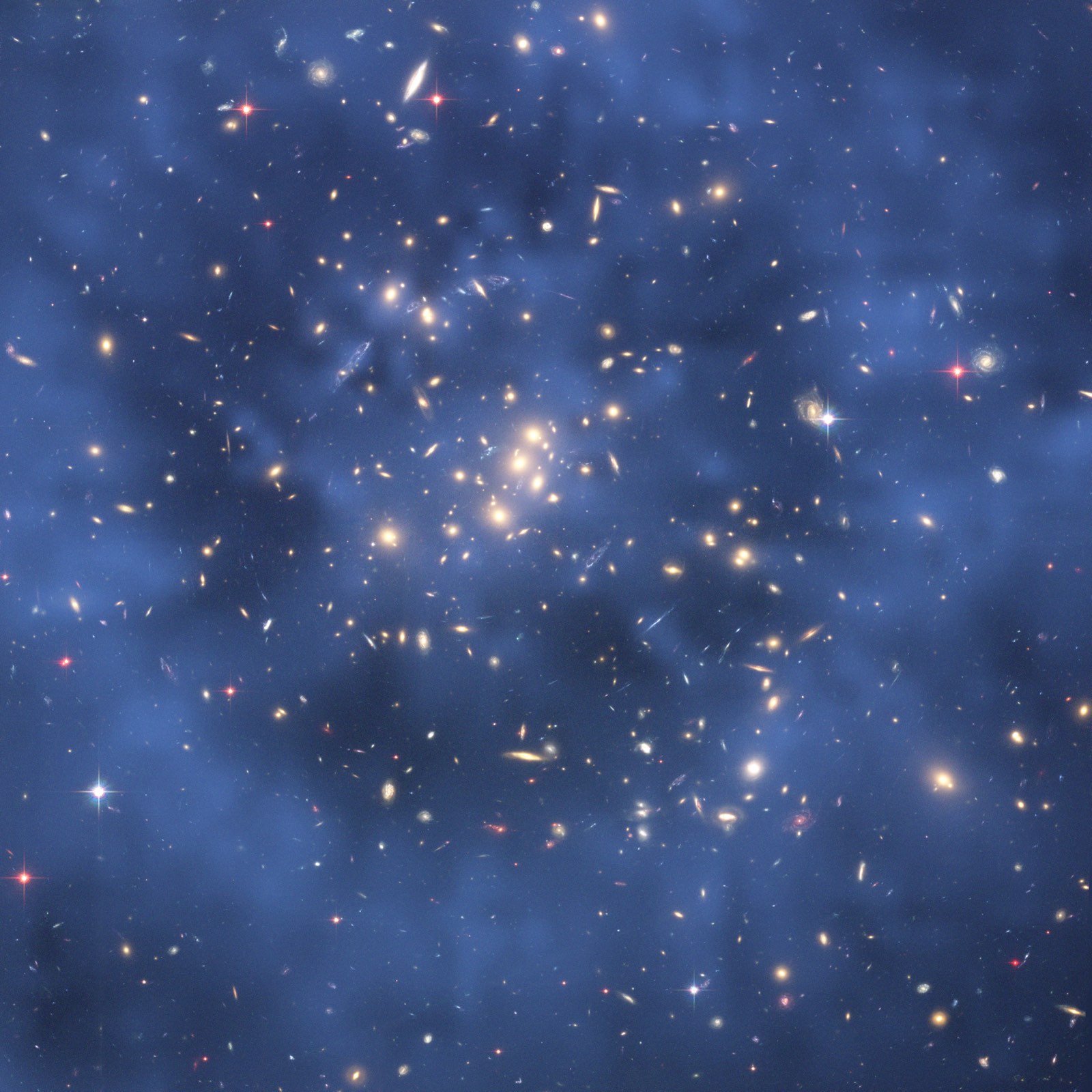 Hubble image of the galaxy cluster Cl 0024+17 with a blue overlay mapping a ring of dark matter inferred from gravitational lensing