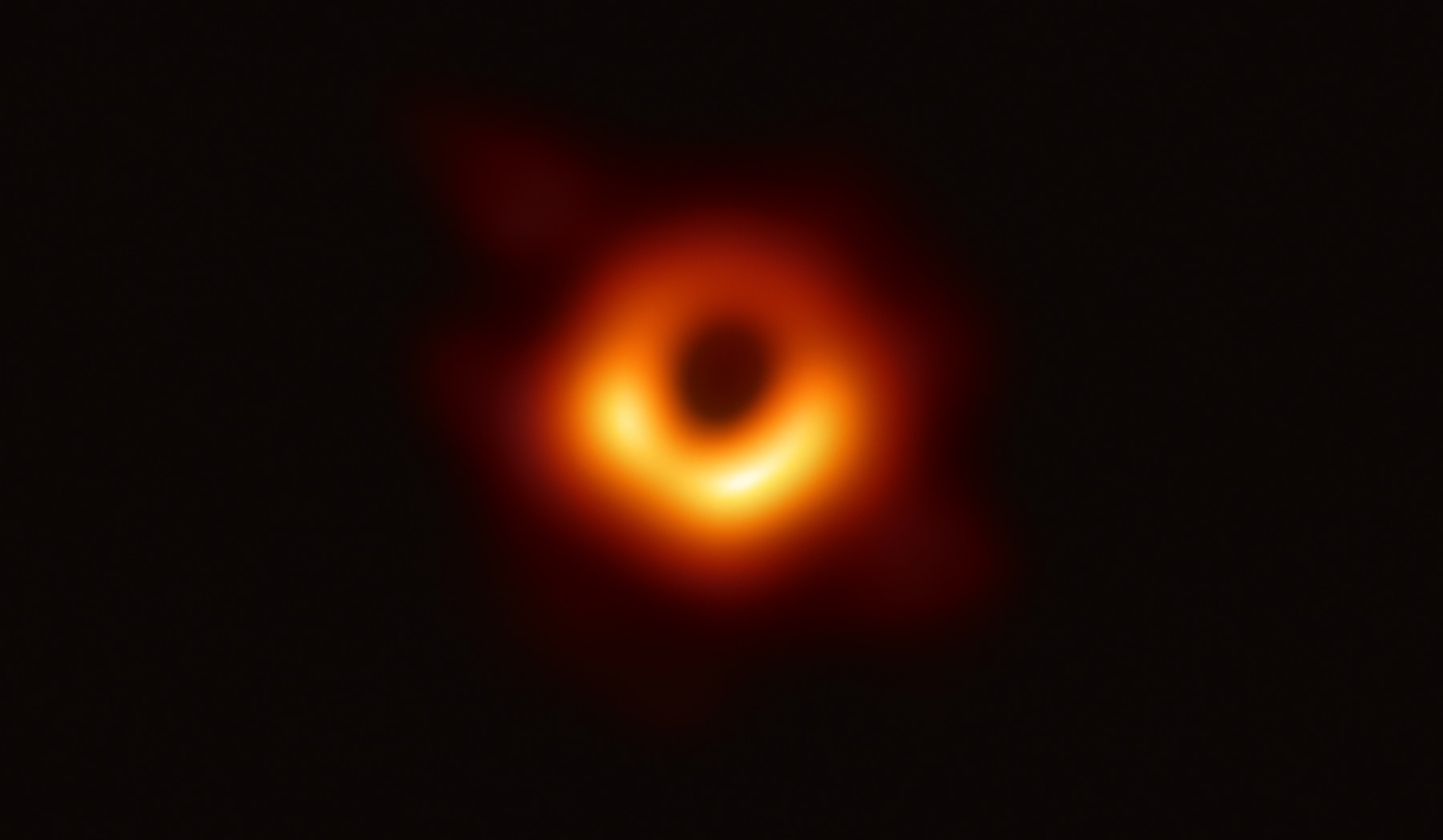 Event Horizon Telescope image of the black hole at the centre of galaxy M87, a glowing orange ring around a dark central shadow