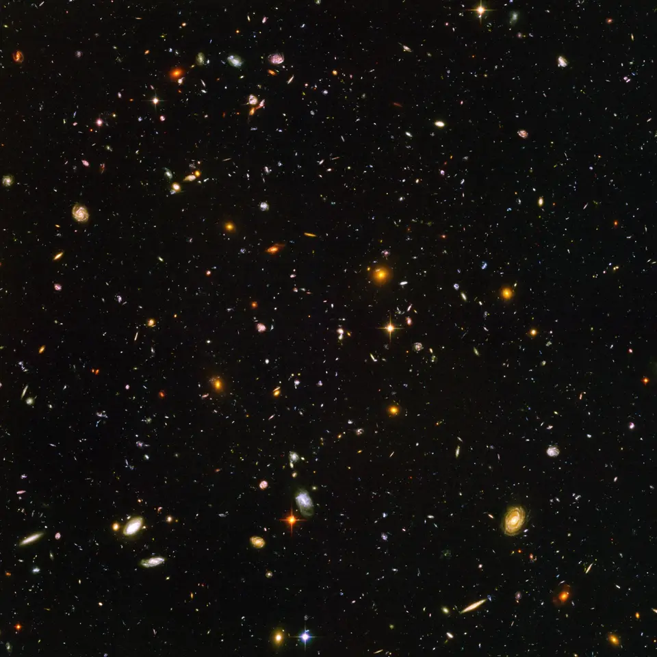 The Hubble Ultra Deep Field: thousands of galaxies of every shape and color in a tiny patch of dark sky.